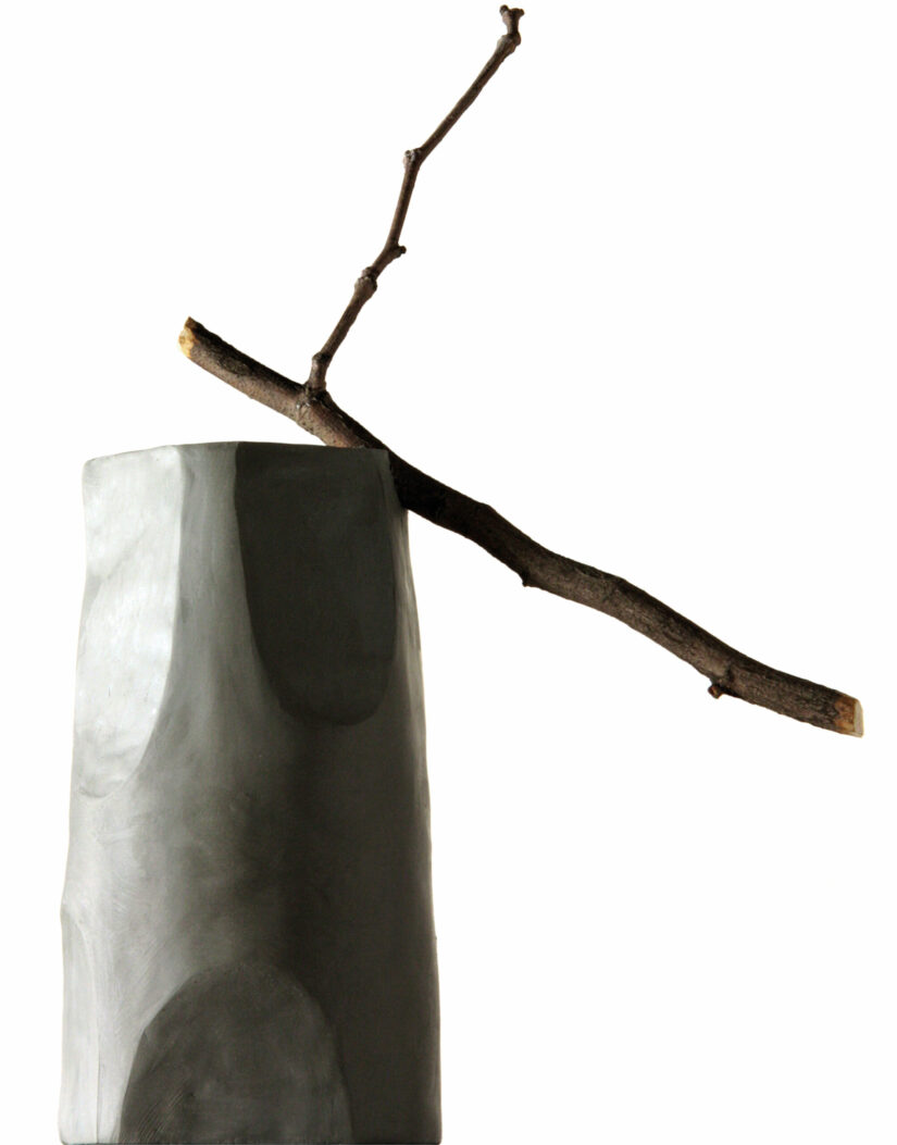 Clay prototype of the Ossidiana Coffee Maker for Alessi, showing the inspiration for the form of the product design with a tree branch as a handle in a withe background.